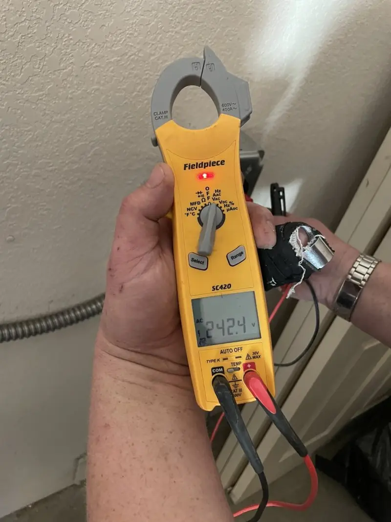 Voltage testing with clamp meter during Ceiling Fan Installation in Wilmington